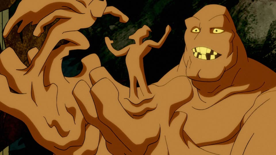 Clayface, the brown shape-shifting Gotham character, forming a tiny figure from his hand